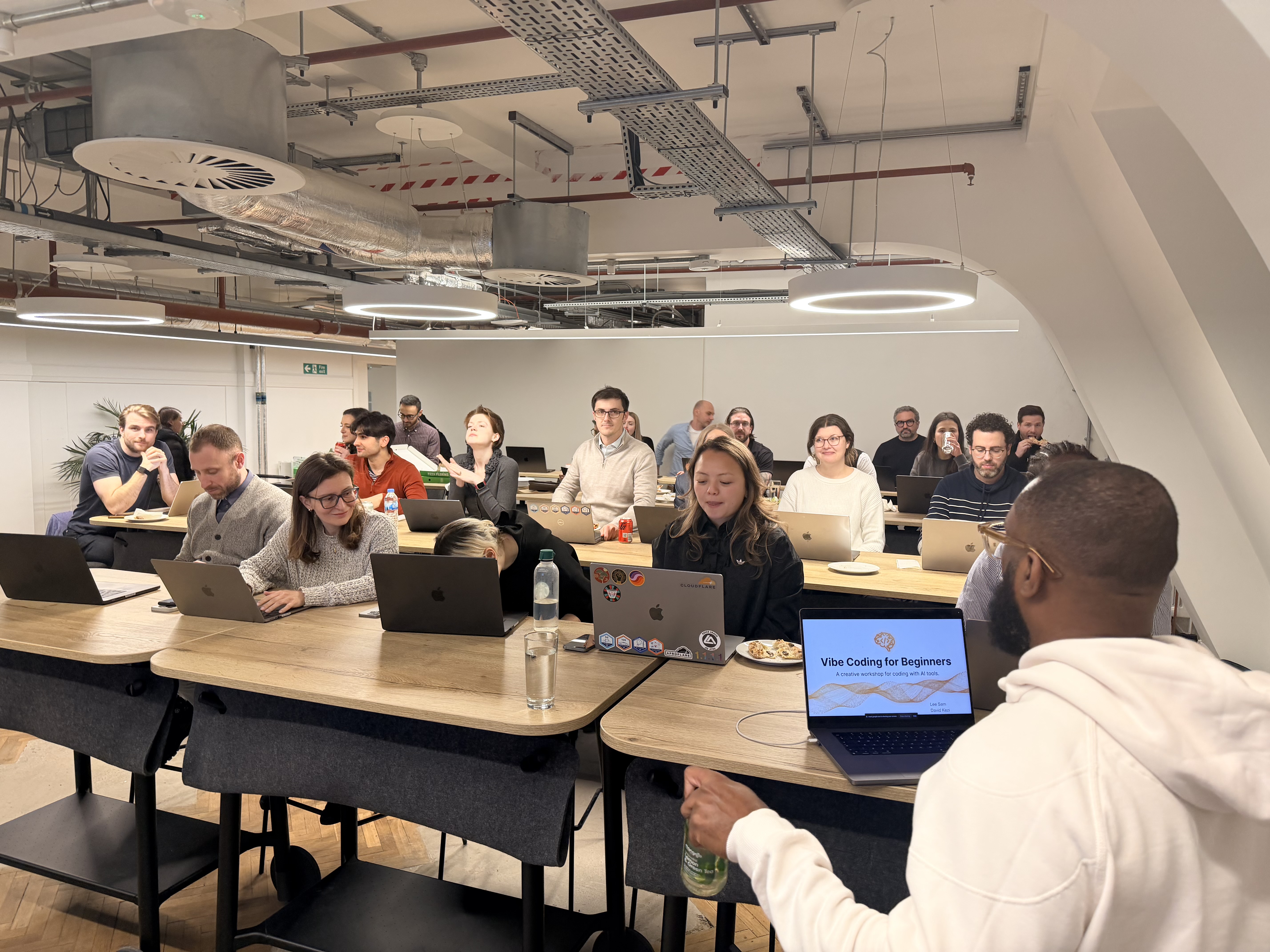 Attendees building projects during the agentic coding workshop