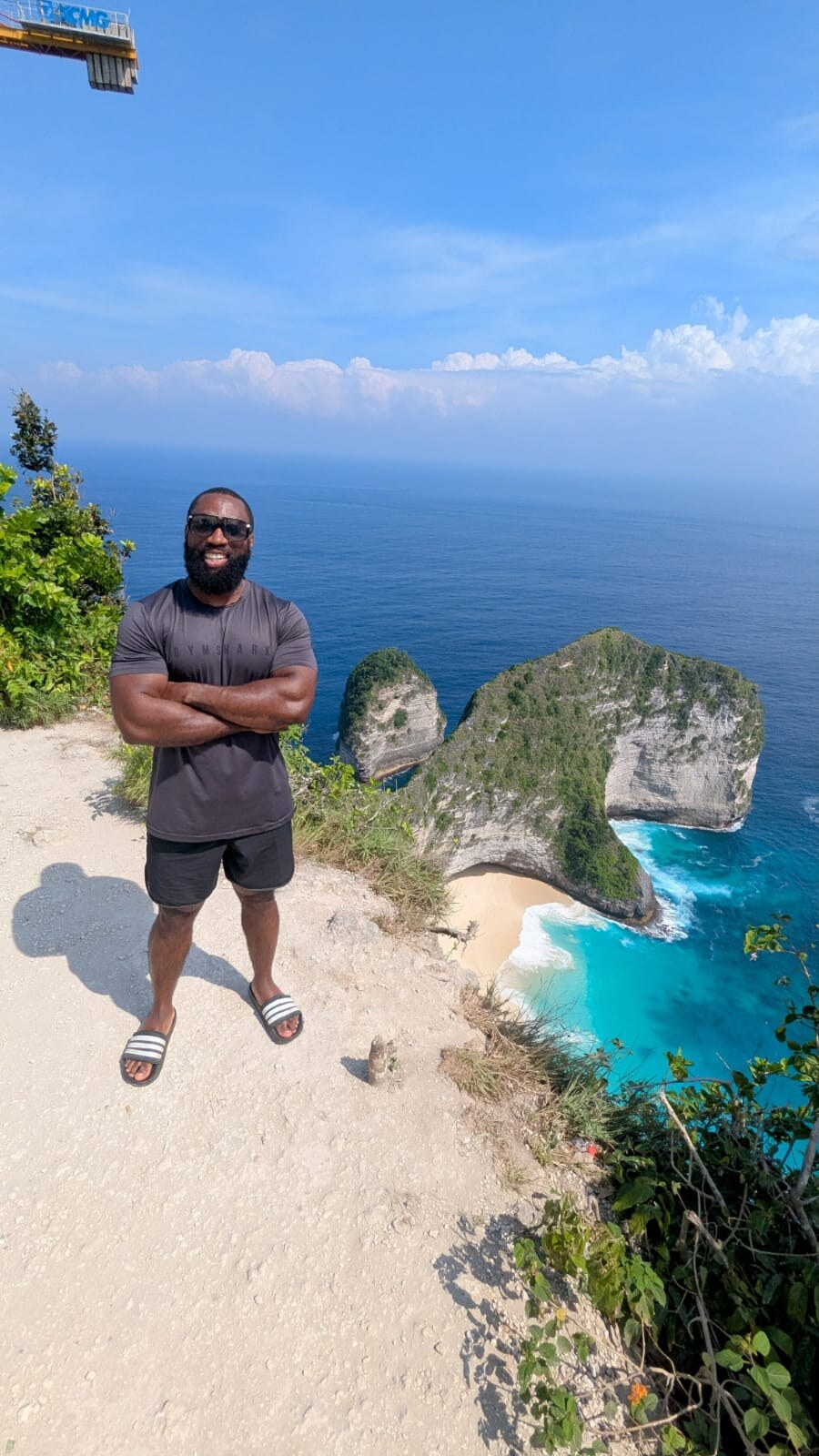 Lee Sam standing above the coastline in Bali